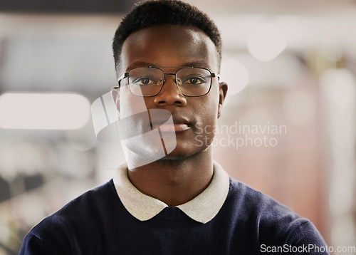 Image of Student, university and portrait of black man on campus for learning, education and vision for future career. Face of African person in library with glasses for research, school project and studying