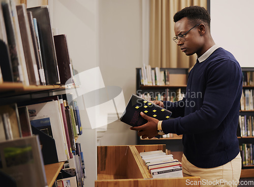 Image of Librarian man, shelf and book with thinking, packing or stock for admin, organized and ideas in workplace. African employee, university or library expert with research, book and reading at workplace