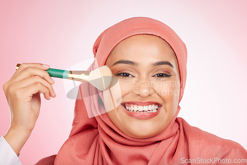 Image of Makeup, brush and muslim woman portrait with a smile from cosmetics and blush in studio. Facial, glow and happy female person with beauty, skincare and shine with a hijab and skin tool for face