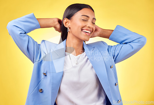 Image of Happy woman, relax or business fashion in studio with smile or confidence on a break on yellow background. Designer, entrepreneur or female creative worker from India resting with pride or wellness