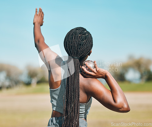 Image of Woman, shot put and athlete throw in competition, challenge or training in field event with metal or steel weight. Throwing, ball or African female outdoor for athletics sport, game or strong contest