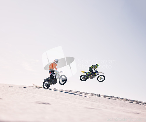 Image of Sports, jump and people on motorcycle driving on sand, beach or training for a challenge, competition or desert rally mockup. Dirt, motorbike and fearless extreme stunt or jumping in space or air