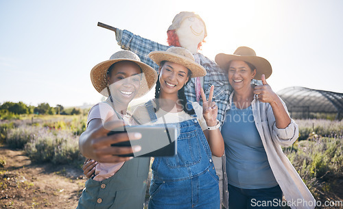 Image of Farmer, women peace sign and selfie in countryside with team and scarecrow outdoor with a smile. Diversity, worker group and happy with social media and profile picture on a agro farm and field