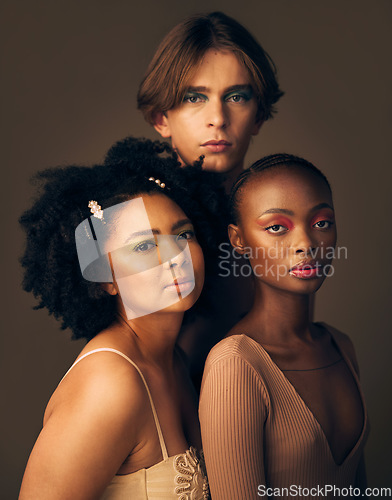 Image of Portrait, skincare or makeup with a man and women in studio on a dark background for beauty or diversity. Face, friends and cosmetics with young people posing for inclusion or artistic freedom