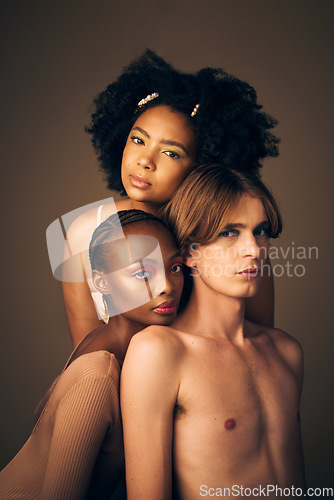 Image of Makeup, glow and portrait of models in studio with creative, cosmetic and facial art for beauty. Queer, diversity and gen z man and women with face inclusion or skincare isolated by brown background.