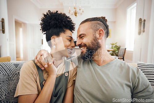 Image of Happy, love or interracial couple on a sofa, care or commitment with relationship, weekend break or loving together. Home, man or woman on a couch, marriage or romantic with bonding, date or relax