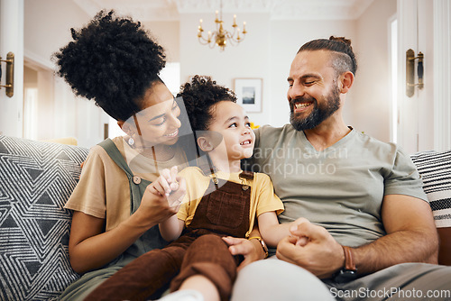 Image of Smile, bonding and interracial family on the sofa for conversation, love and talking. Happy, house and a mother, father and a boy child on the couch for comfort, care and together for communication