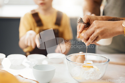 Image of Hands, crack egg and cooking in kitchen on bowl on table with family in home. Food, bakery and break eggshell for ingredient in flour for healthy diet, protein nutrition and preparation of pastry.