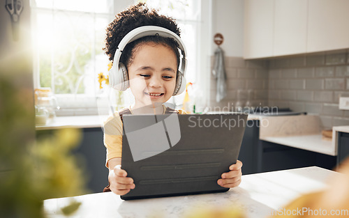 Image of Tablet, headphones and child elearning in home, happy and online education for homeschool. Smile, technology and boy kid on video call, studying on internet and listening to music in virtual class