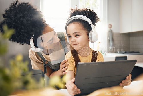 Image of Mother, child and tablet with headphones, home or happy for movie, music or streaming subscription. Mom, kid and digital touchscreen for education, learning or online course with help in family house