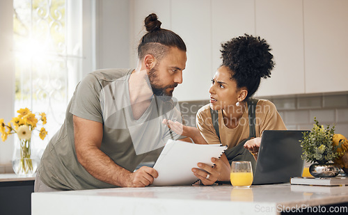 Image of Debt, documents and couple in kitchen with laptop argue for financial bills, online payment and banking. Marriage, stress and man and woman on computer with mortgage, insurance paperwork and budget