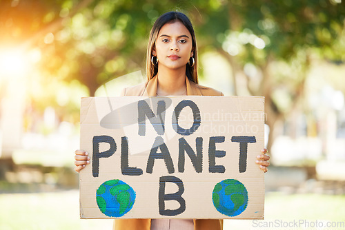 Image of Woman, poster and save planet sign at park for climate change, environment and green eco friendly protest. Young person in portrait and nature, earth or globe support for sustainable world and action