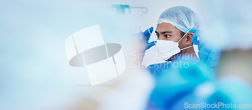 Image of Surgeon, face mask and hospital doctor in ICU for healthcare, medical and clinic work. Prepare, surgery and working in operating room with hygiene and safety protection for wellness with mockup space