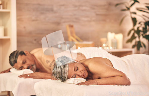 Image of Wellness, massage and couple in spa to relax on holiday, vacation and anniversary celebration. Love, luxury resort and mature man and woman on bed in salon for beauty, therapy and skincare treatment