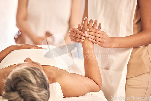 Image of Spa, relax and a woman with a hand massage for wellness, salon treatment and grooming. Luxury, skincare and a person with a masseuse for a manicure, stress relief or beauty circulation at a hotel