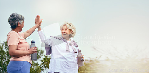 Image of Senior women, walking and high five for motivation and workout success from outdoor fitness. Banner, elderly friends and happy from sport and exercise together with support smile and mockup space