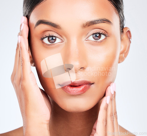 Image of Closeup portrait of Indian woman for skincare, beauty and cosmetics on white background. Dermatology, spa aesthetic and serious face of isolated person for wellness, salon and facial glow in studio