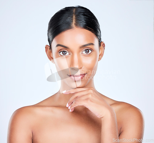 Image of Studio portrait of Indian woman for dermatology, skincare and cosmetics for salon aesthetic. Beauty, spa and face of isolated person for wellness, satisfaction and facial glow on white background