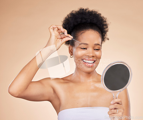 Image of Woman, tweezers and mirror for eyebrow in studio, beauty or thinking for results, reflection or idea by background. African girl, model and smile for facial hair removal, inspection or transformation