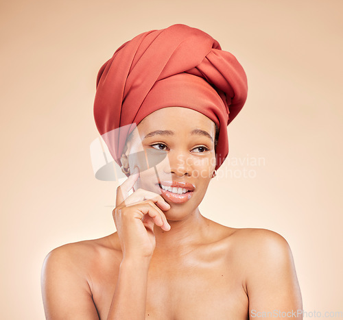 Image of Beauty, thinking and black woman in studio with hair scarf, idea or smile for natural cosmetics on brown background. Happy, skincare and African lady model with head wrap, wellness or glow treatment