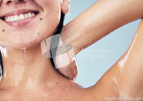 Image of Shower, smile and woman in studio for body care, wellness and cleaning on blue background. Hygiene, skincare and happy female model with in a bathroom for hair, cosmetics and relax while washing