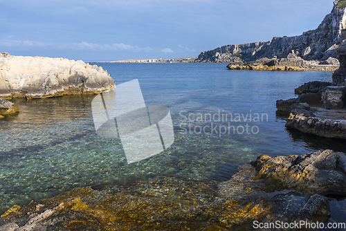 Image of Landscape with rocky coast in the evening