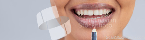 Image of Makeup, beauty and lips of woman with pencil in studio for wellness, skincare product and cosmetics. Salon, banner and face zoom of person with lipstick or lip liner for glamour, makeover and glow