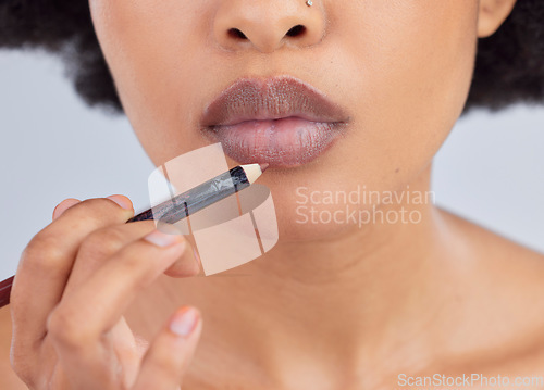 Image of Makeup, beauty and lips of woman with pencil in studio for wellness, skincare product and cosmetics. Salon, aesthetic and face zoom of person with lipstick or lip liner for glamour, makeover and glow
