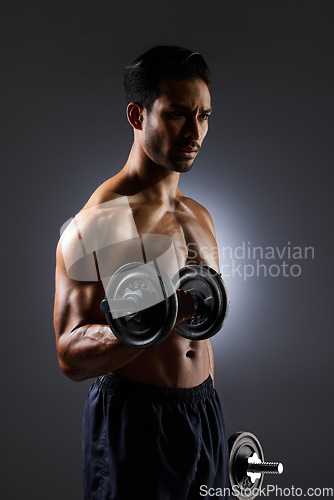 Image of Thinking, dark and a man with weights on a black background for muscle, fitness and exercise. Sports, idea and an Asian bodybuilder or strong athlete doing weightlifting for training with power