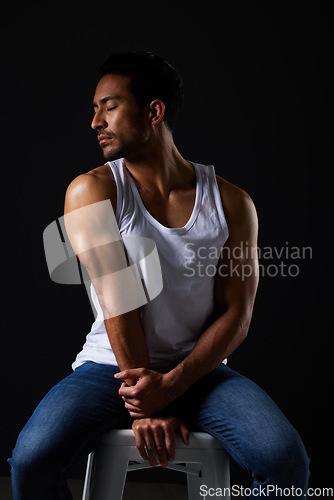 Image of Relax, muscle and sexy man on chair in studio with fitness inspiration, beauty aesthetic and sensual fashion. Erotic art, sexual body and male model on black background, thinking with dark lighting.