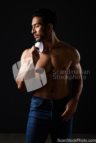 Image of Sexy, muscle and topless man in studio with fitness inspiration, beauty aesthetic and sensual fashion. Erotic art, sexual body and male model sitting on black background, thinking in dark lighting.