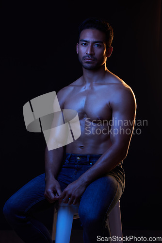 Image of Topless, portrait and sexy man in neon studio for fitness inspiration, beauty aesthetic or sensual fantasy. Erotic art, sexual body and male model with muscle, black background and dark blue lighting