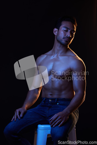 Image of Topless, sexy man in dark studio for fitness inspiration, beauty aesthetic or sensual fantasy. Erotic art, sexual body and seductive male model with muscle, black background and neon blue lighting.