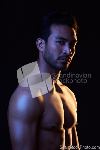 Image of Shirtless, portrait and sexy man on black background in fitness inspiration, beauty aesthetic or sensual fantasy. Erotic art, sexual body or seductive male model with muscle, studio and neon lighting