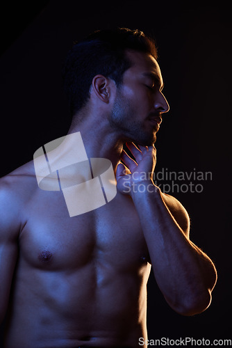 Image of Sexy, topless and sensual man on black background in fitness inspiration, beauty aesthetic or fantasy. Erotic art, sexual body or seductive male model with muscle motivation, studio and dark lighting