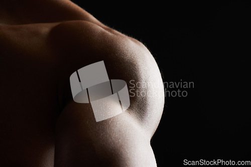 Image of Shoulder, closeup and muscle of man in studio isolated on a black background mockup space. Body, strong and arm of model in fitness, bodybuilder power and workout for health, wellness and exercise