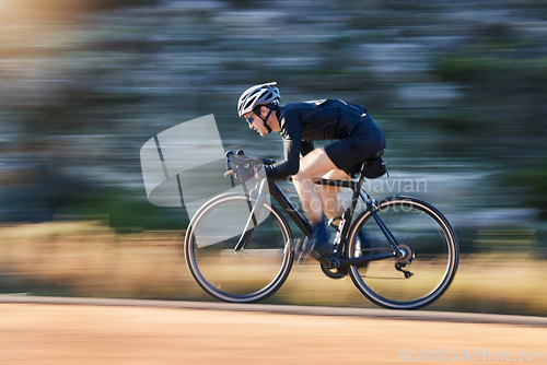 Image of Motion blur, speed and cyclist on bicycle on road in mountain with helmet, exercise adventure trail and fitness. Cycling race, nature and man with bike for fast workout, training motivation or energy