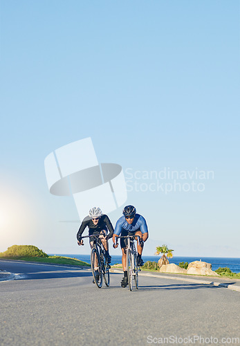 Image of Competition, fitness and men on bicycle on road in nature with helmet, exercise adventure and speed. Cycling race, blue sky and cyclist race with bike for fast workout, training motivation and energy