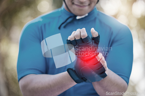 Image of Man, cycling or hand on wrist pain, joint injury or emergency in training, workout or fitness exercise. Injured cyclist, accident or closeup of hurt athlete with problem in race or activity in nature