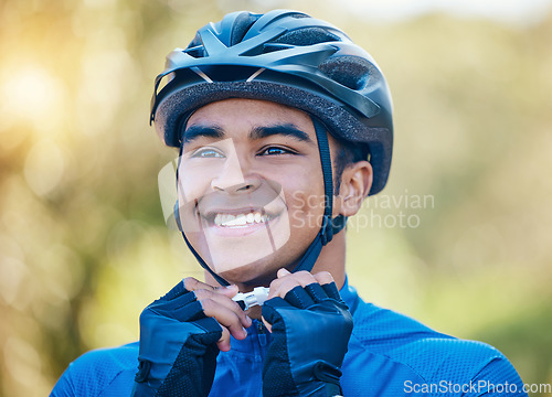 Image of Exercise, cycling helmet and man outdoor for sports, workout or training with happy smile. Face of young athlete or cyclist with safety, wellness and fitness at park or thinking to start performance