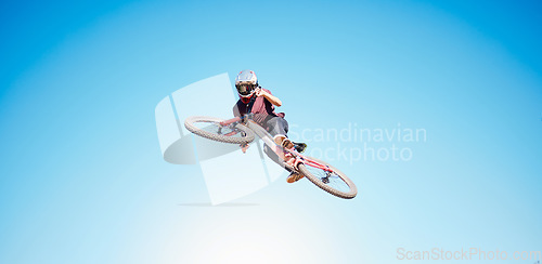 Image of Sky, cycling and a person jump outdoor for sports, workout or training with skills and stunt. Athlete or cyclist with safety, wellness and fitness or banner space with balance and bicycle in air