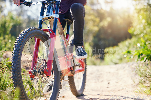 Image of Nature, cycling and feet with a bicycle for travel, fitness or training on the mountain. Closeup, morning and legs of a person with a bike on a path for a triathlon, exercise or sports adventure