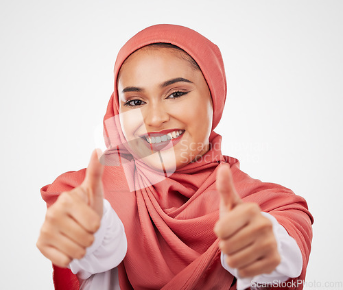 Image of Muslim, woman and thumbs up, hands and agreement with smile in portrait isolated on white background. Hijab, opinion with communication and success, support and like emoji with vote in a studio