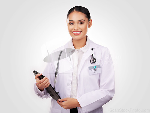 Image of Happy woman, doctor and portrait with tablet in healthcare research or online advice against a studio background. Female person or medical professional smile with technology for Telehealth on mockup