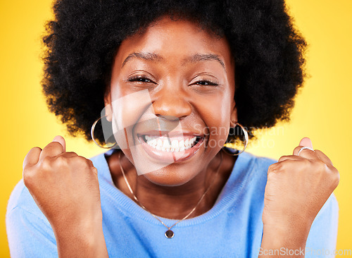 Image of Black woman, face portrait and fist for success, celebrate promotion or winning lottery bonus on yellow background. Excited model, cheers or celebration of achievement, deal or lotto winner in studio