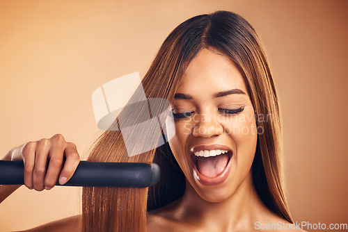 Image of Excited, hair straightener and beauty of a woman in studio for cosmetics or mockup. Aesthetic model on brown background for wow heat treatment, healthy results and hairdresser or salon flat iron