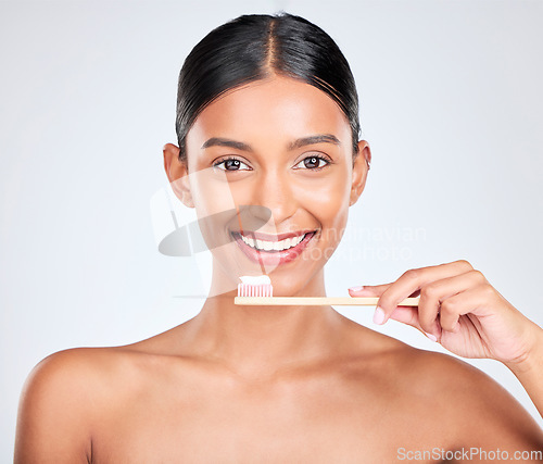 Image of Toothbrush, toothpaste and dental with woman in portrait, health and fresh breath isolated on white background. Bamboo, face and teeth whitening with oral care, orthodontics and routine in studio