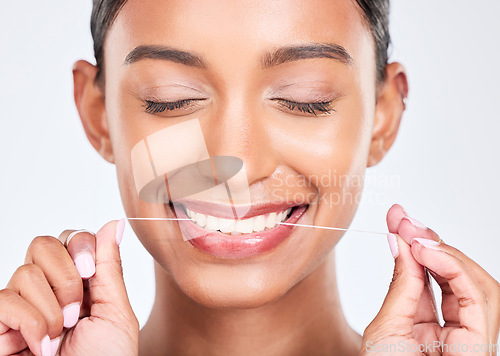 Image of Mouth, flossing and dental with woman and face, health and fresh breath isolated on white background. Cleaning plaque, thread and teeth whitening with oral care, orthodontics and routine in studio