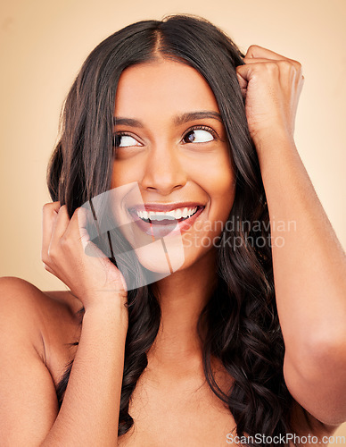 Image of Hair care, beauty and young woman in studio for shiny, long and clean hairstyle with salon treatment. Wellness, health and female model with cosmetic routine for hair maintenance by brown background.