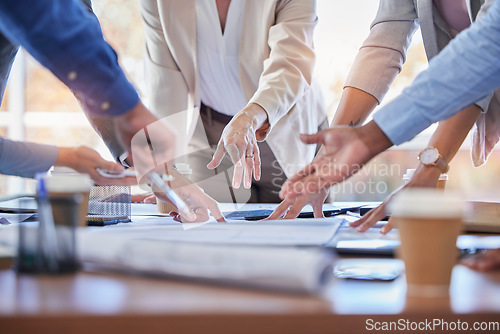 Image of Business people, hands and meeting with documents in strategy, planning or ideas together at office. Closeup of group in project plan, collaboration or teamwork on paperwork or blueprint at workplace